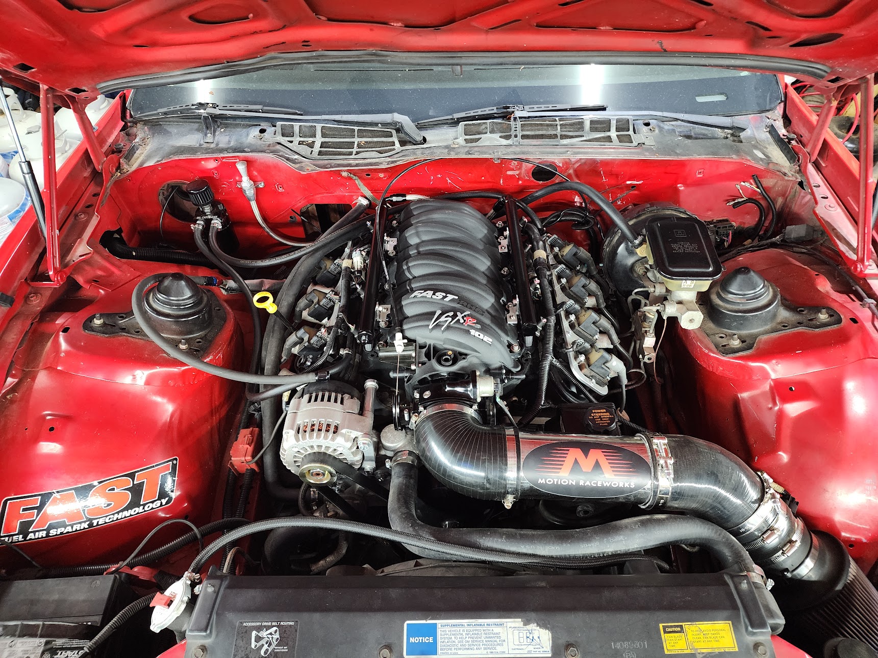 The LQ4 in the bay with the FAST LSXR intake and Motion Raceworks throttle body